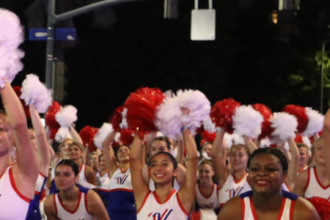 athletes performing in the pearl harbor memorial parade for a varsity spirit special event